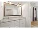 Bathroom featuring double vanity, large mirror, and access to shower and bedroom at 2922 Parkridge Ne Dr, Brookhaven, GA 30319