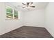 Bright bedroom featuring a window overlooking the backyard and hardwood floors at 2922 Parkridge Ne Dr, Brookhaven, GA 30319