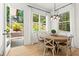 Breakfast nook with wood table, natural light, and backyard view at 2922 Parkridge Ne Dr, Brookhaven, GA 30319
