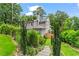 Exterior of home with manicured lawn, garden, and charming stone pathway at 2922 Parkridge Ne Dr, Brookhaven, GA 30319