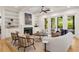 Bright living room boasting built-in shelving, a cozy fireplace, and sliding doors that open to the patio at 2922 Parkridge Ne Dr, Brookhaven, GA 30319