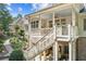 Backyard with stairs leading to a porch at 3088 Hidden Falls Dr, Buford, GA 30519