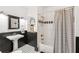 Classic bathroom featuring a pedestal sink, black and white tile floors, and a shower with striped curtain at 3088 Hidden Falls Dr, Buford, GA 30519