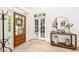 Bright foyer featuring hardwood floors, a glass paneled front door, and contemporary decor at 3088 Hidden Falls Dr, Buford, GA 30519