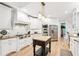Gourmet kitchen with white cabinets, stainless steel appliances, and granite countertops at 3088 Hidden Falls Dr, Buford, GA 30519