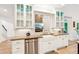 Charming kitchen features a farmhouse sink and stainless dishwasher at 3088 Hidden Falls Dr, Buford, GA 30519