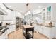 Well-appointed kitchen with a central island, stainless appliances, and white cabinetry at 3088 Hidden Falls Dr, Buford, GA 30519