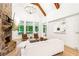 Spacious living room with stone fireplace, ample windows, and hardwood floors at 3088 Hidden Falls Dr, Buford, GA 30519