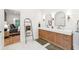 Bright bathroom featuring double vanity, modern mirrors, and ensuite bath at 3088 Hidden Falls Dr, Buford, GA 30519