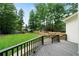 Large backyard with a wooden fence, wooden stairs, and lush green grass at 4544 Cavallon Nw Way, Acworth, GA 30101