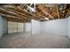 Unfinished basement, with open ceiling and concrete flooring, offering potential for customization and expansion at 4544 Cavallon Nw Way, Acworth, GA 30101