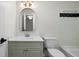 Bathroom with a vanity sink, arched mirror, and tiled shower at 4544 Cavallon Nw Way, Acworth, GA 30101
