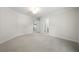 An empty bedroom with carpeted floors, crown molding, and white walls at 4544 Cavallon Nw Way, Acworth, GA 30101