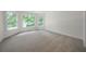 Empty bedroom with large windows, carpeted floors, and white walls at 4544 Cavallon Nw Way, Acworth, GA 30101
