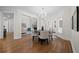 Bright dining room featuring hardwood floors, chandelier, and comfortable seating for intimate gatherings at 4544 Cavallon Nw Way, Acworth, GA 30101