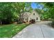 Charming two-story home with stone and siding, a manicured lawn, and mature trees at 4544 Cavallon Nw Way, Acworth, GA 30101