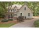 Beautiful home exterior showcasing the stone accents, manicured landscaping, and circular driveway at 4544 Cavallon Nw Way, Acworth, GA 30101