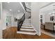 Elegant foyer with hardwood floors, a staircase, and views of the living spaces at 4544 Cavallon Nw Way, Acworth, GA 30101