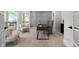 Bright home office space featuring neutral walls, a modern desk, and comfortable seating near sunlit windows at 4544 Cavallon Nw Way, Acworth, GA 30101