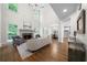 Bright living room with a stone fireplace, hardwood floors, and large windows at 4544 Cavallon Nw Way, Acworth, GA 30101