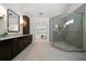 Spa-like main bathroom with a glass-enclosed shower, dual vanity, and tiled floors at 4544 Cavallon Nw Way, Acworth, GA 30101