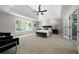 Spacious main bedroom with a tray ceiling, carpet flooring, and natural light at 4544 Cavallon Nw Way, Acworth, GA 30101