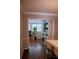 Dining area showcasing neutral paint, hardwood floors, and a home office space in view at 37 La Rue Nw Pl, Atlanta, GA 30327