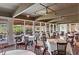 Large dining room with garden views through large sliding glass doors and windows, with multiple tables and chairs at 37 La Rue Nw Pl, Atlanta, GA 30327