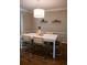 Dining room featuring stylish chairs, hardwood flooring, and a modern light fixture at 37 La Rue Nw Pl, Atlanta, GA 30327