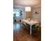 Open dining area with wood floors, sleek decor, and a view into another living space at 37 La Rue Nw Pl, Atlanta, GA 30327