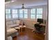 Bright living room featuring a comfortable sectional sofa, workspace, and plenty of natural light at 37 La Rue Nw Pl, Atlanta, GA 30327