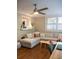 Comfortable living space with a sectional sofa, hardwood floors, and natural light from shuttered windows at 37 La Rue Nw Pl, Atlanta, GA 30327