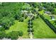Expansive property with beautiful home, outbuildings, and tree-lined driveway surrounded by greenery at 3700 Tom Brewer Rd, Loganville, GA 30052