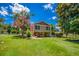 View of the backyard showcasing a home with an outdoor seating area and fenced yard at 3700 Tom Brewer Rd, Loganville, GA 30052