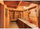 Unfinished basement with exposed wood framing and shelving at 3700 Tom Brewer Rd, Loganville, GA 30052