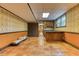 Basement featuring tile flooring, wooden cabinets, and a sink at 3700 Tom Brewer Rd, Loganville, GA 30052