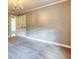 Bedroom with carpet, chandelier, and white double doors at 3700 Tom Brewer Rd, Loganville, GA 30052