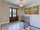 Foyer with patterned tile, chandelier, and a tapestry on the wall by the entrance at 3700 Tom Brewer Rd, Loganville, GA 30052