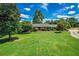 Beautiful home with well-manicured front yard, mature trees, and inviting curb appeal at 3700 Tom Brewer Rd, Loganville, GA 30052