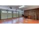 Spacious three-car garage with red painted floor, brick wall and ceiling storage at 3700 Tom Brewer Rd, Loganville, GA 30052