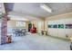 Open garage with an indoor/outdoor feel with an inviting seating area and a ceiling fan at 3700 Tom Brewer Rd, Loganville, GA 30052