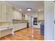 Kitchen showcasing custom cabinets, modern built-in appliances, and counter seating at 3700 Tom Brewer Rd, Loganville, GA 30052