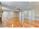 Expansive living room featuring hardwood floors, a fireplace, and recessed lighting at 3700 Tom Brewer Rd, Loganville, GA 30052