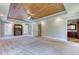 Spacious main bedroom features a wood paneled tray ceiling and a fireplace at 3700 Tom Brewer Rd, Loganville, GA 30052