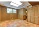 Room featuring wood paneled walls, tile flooring, a closet, and a window at 3700 Tom Brewer Rd, Loganville, GA 30052
