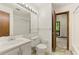 A full bathroom with a tiled shower, vanity, and mirror at 70 Juliana Dr, Ellenwood, GA 30294