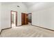 Bedroom with a vaulted ceiling, multiple closets, and access to another room at 70 Juliana Dr, Ellenwood, GA 30294