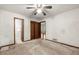 Bedroom featuring closet, interior doors, and trim detail at 70 Juliana Dr, Ellenwood, GA 30294