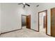 A spacious bedroom with a ceiling fan, closet, and an ensuite bathroom at 70 Juliana Dr, Ellenwood, GA 30294