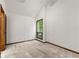 A bedroom featuring neutral carpet, a window with a view, and ample natural light at 70 Juliana Dr, Ellenwood, GA 30294